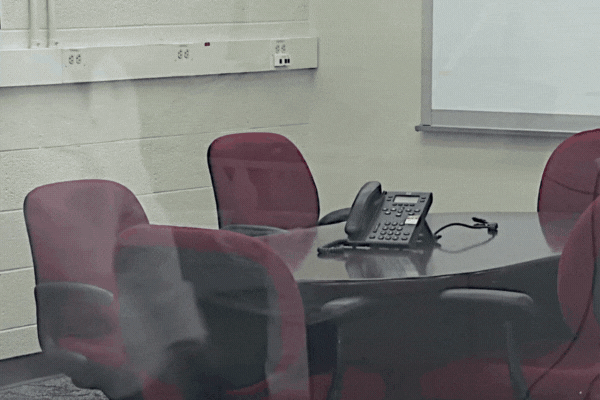 A person attempts to break the glass, but it holds firm due to an invisible layer of security film. This illustrates how security window film reinforces glass to resist shattering, aligning with the question: What is Security Window Film.